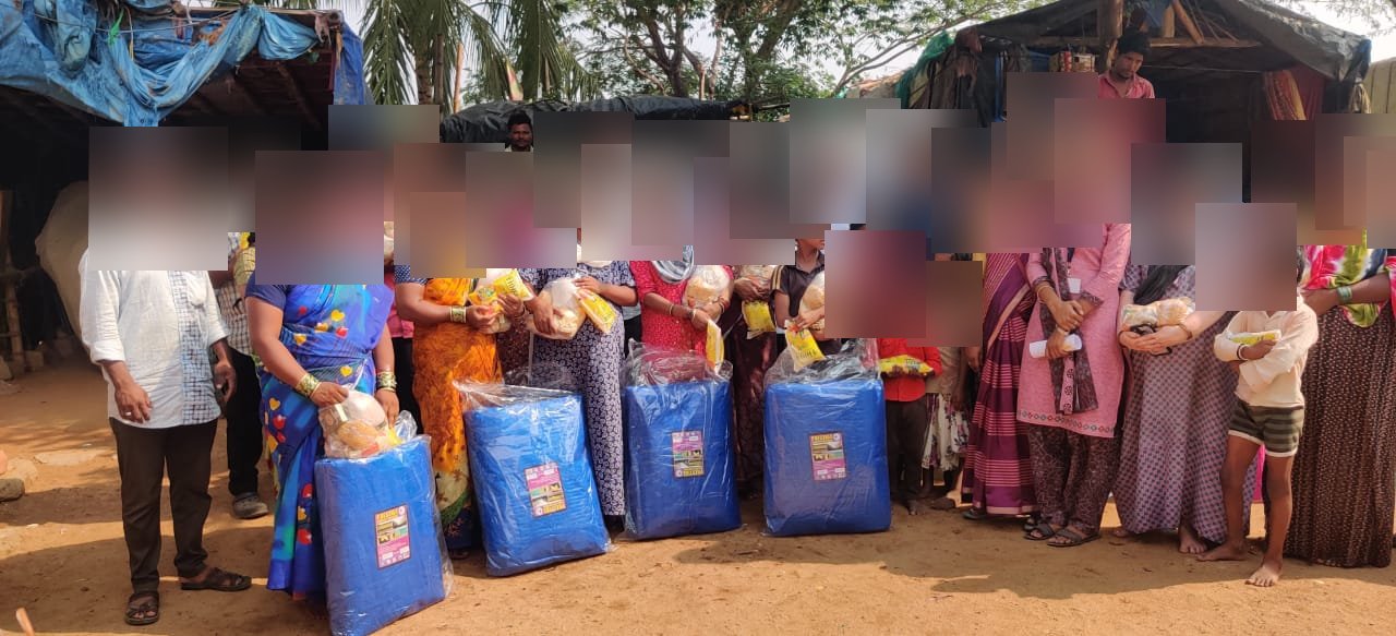 Tarpaulin distribution to tribal families in Gauribidanur